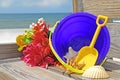 Beach pail and flowers Royalty Free Stock Photo