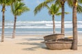 Beach with coconut trees and coracles in Danang, Vietnam