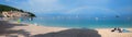 Beach panorama Moscenicka Draga, adriatic ocean with boats, rainbow over the water