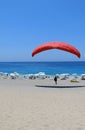 Beach paragliding pilots who practice Royalty Free Stock Photo