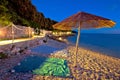 Beach and parasol on colorful evening view, Adriatic sea