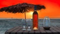Beach party in cafe with bottle of rose wine and glasses at sunset, GOA, India Royalty Free Stock Photo