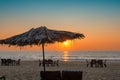 Beach party at Sunset with umbrellas, tables and chairs in GOA Royalty Free Stock Photo