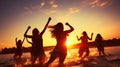 Beach Party. Teenage girls having fun in water. Group of happy young people dancing at the beach on beautiful summer sunset. Royalty Free Stock Photo