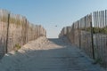 Beach path in sand dune beach. Wooden beach path with wooden fences. Royalty Free Stock Photo