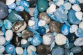 Beach pebble rocks and seashells. Blue toned nature backgound image