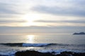 Sunset on the beach. Clouds on the horizon with a calm sea,