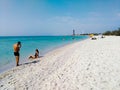 Photographer photographing a model, girl on beach