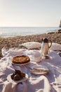 Beach picnic with cake, figs and tea