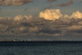 Beach picture with windmills sea and clouds on the sky Royalty Free Stock Photo