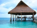 Beach Pier with Palapa Hut on Ocean Royalty Free Stock Photo