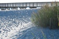 Beach pier walkway, sand, sea oats, and ocean Royalty Free Stock Photo