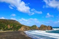 The beach at Piha, New Zealand, looking towards Taitomo Island and Nun Rock Royalty Free Stock Photo