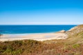 Beach Pit on Breton coastline in France Frehel Cape region with its sand, rocks and moorland in summer