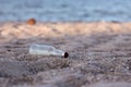 Beach pollution. Plastic bottles and other trash on sea beach. Ecological concept. earth day concept. globe pollution. Garbage on Royalty Free Stock Photo
