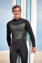 Beach, portrait or happy man with surfboard for exercise, fitness for body health or summer outdoor. Surfer, wetsuit or Royalty Free Stock Photo