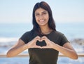 Beach portrait and heart hand woman for summer holiday freedom, happiness and wellness. Happy Indian girl enjoying sun Royalty Free Stock Photo