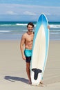 Beach portrait, surfboard and sports man on holiday, vacation or Spain getaway for nature, freedom or natural outdoor