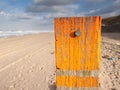 Beach post with sea level marker