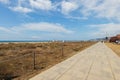 Beach promenade at Castelldefels, Barcelona, Spain. Long way walking road close to the sea with beautiful view Royalty Free Stock Photo