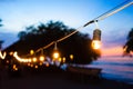 Beach promenade at night with party lights