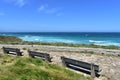 Beach promenade with wooden benches and viewpoint. Lugo, Spain. Royalty Free Stock Photo