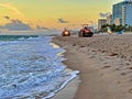 Beach Raker smoothing sand at dawn