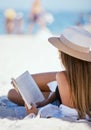 Beach, reading a book and woman relax, summer vacation and getaway on a weekend break, peace and sand. Female person Royalty Free Stock Photo