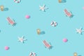 Beach relaxation items pattern against the sunny blue background. Royalty Free Stock Photo