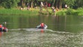 Beach-rescue is riding the boat slowly along the river