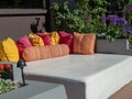 A beach resort outdoor daybed and pillows ready for lounging at poolside