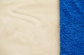 Beach resort theme background, texture. Blue towel on the sand. Royalty Free Stock Photo