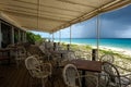 Beach restaurant during low season with passing rain cloud, Anguilla, British West Indies, BWI, Caribbean Royalty Free Stock Photo