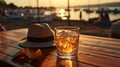 beach restaurant on sunset sea,glass of wine and hat ,yacht boat on sea water, Royalty Free Stock Photo