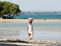 Beach retracting water and walking woman with basket on her head, Madagascar Royalty Free Stock Photo