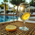 Beach retreat wicker table, empty wine glass with lemon inside