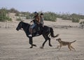 Beach riding with the dog Royalty Free Stock Photo