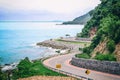 The beach road with mountains, sea, beautiful sky. Royalty Free Stock Photo