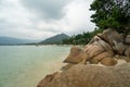 Beach with a rocks in cloudy day on tropical island at South of Thailand.