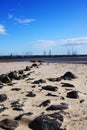 Beach with rocks leading into water Royalty Free Stock Photo