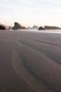 A beach with a rocky shoreline and a few sea stacks.