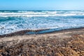 Beach with rough sea in a sunny day Royalty Free Stock Photo