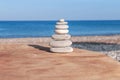 Beach round pebble stone set balance arrangement like zen symbol Royalty Free Stock Photo