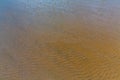 Beach sand background. Footprints in the sand. Royalty Free Stock Photo