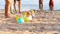 on the beach, on the sand are balloons filled with water instead of air. people having a rest playing fun games on the Royalty Free Stock Photo