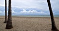 Beach with overcast skyand thick white clouds