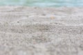 Beach sand blue sea water summer background with shallow depth of field Royalty Free Stock Photo