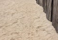 Beach sand with curved sand dune fencing abstract Royalty Free Stock Photo