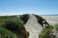 Beach with sand dunes and a path to the sea Royalty Free Stock Photo