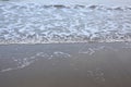 beach sand and foam waves